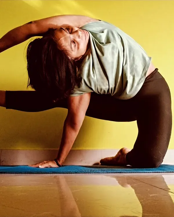 I believe in exploring the body's potential through dedicated practice. This advanced asana demonstrates the flexibility and strength we can build together, always honoring the principle of 'Sthiram Sukham Asanam', finding stability and ease in every pose.