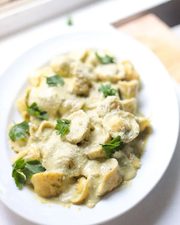 A creamy tortellini dish, perfectly cooked and plated. In our Italian classes, you learn to make both the pasta and the sauce from scratch.