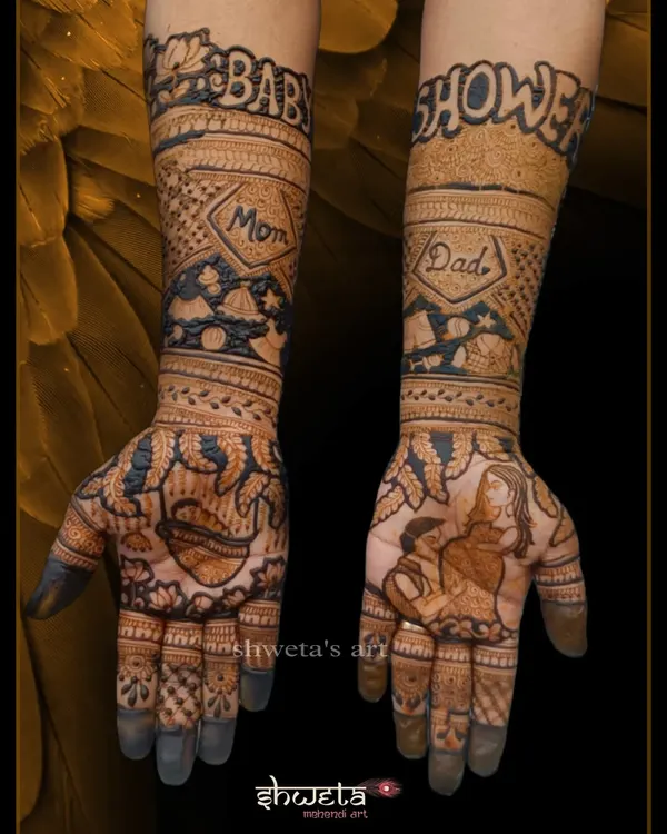 A complete baby shower mehendi design. This features a portrait of the pregnant mother on one palm and "Baby Shower" written on the arms, with cute baby-related motifs.