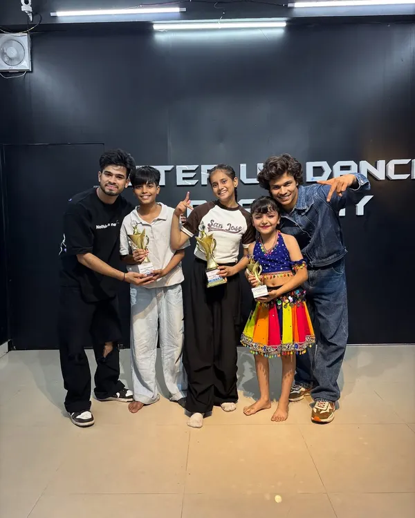 Celebrating our competition winners. Seeing students of all ages holding trophies is the best reward for a teacher.