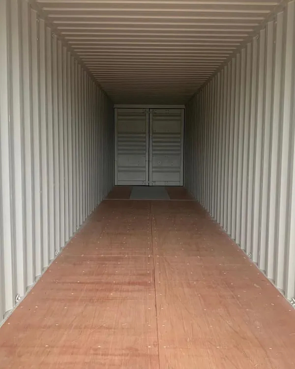 Every project begins with a pristine, high-cube container. This interior view shows the clean, structurally sound "blank canvas" with its durable flooring, ready for custom fabrication and design.