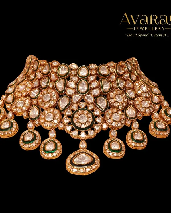 A magnificent Kundan and Polki choker, showcasing intricate floral motifs and uncut stones. This piece is a testament to traditional craftsmanship.