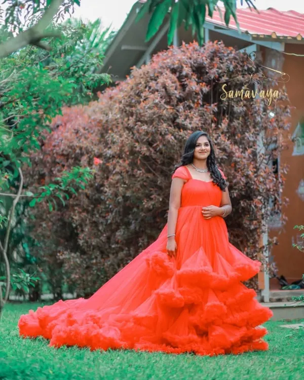 This vibrant red frill gown is available for rent and is a showstopper for any outdoor maternity or pre-wedding shoot.
