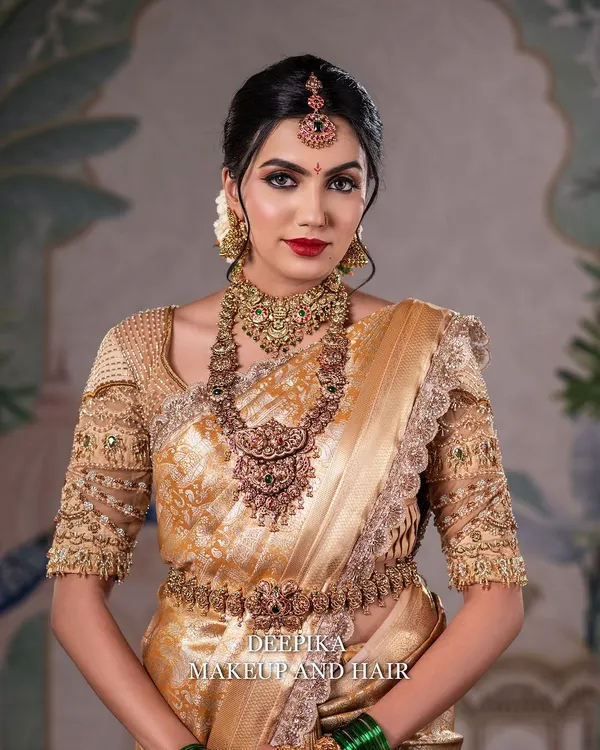 This is the magic we create. A stunning South Indian bridal look with flawless, glowing skin, bold red lips, and perfectly defined eyes, complemented by traditional gold jewelry. This is the level of perfection I teach and deliver.