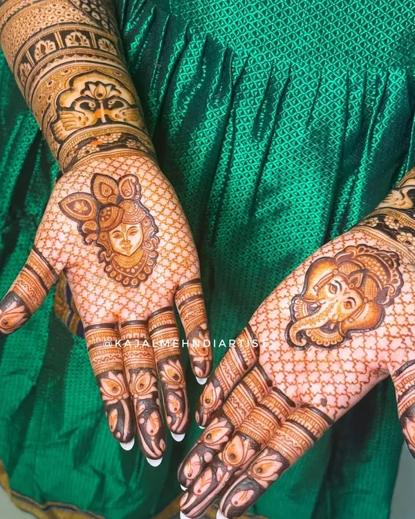 A prayer on the palms. This bridal design features portraits of Shreenathji and Ganpati Bappa to bless the new beginning, surrounded by a delicate net pattern.