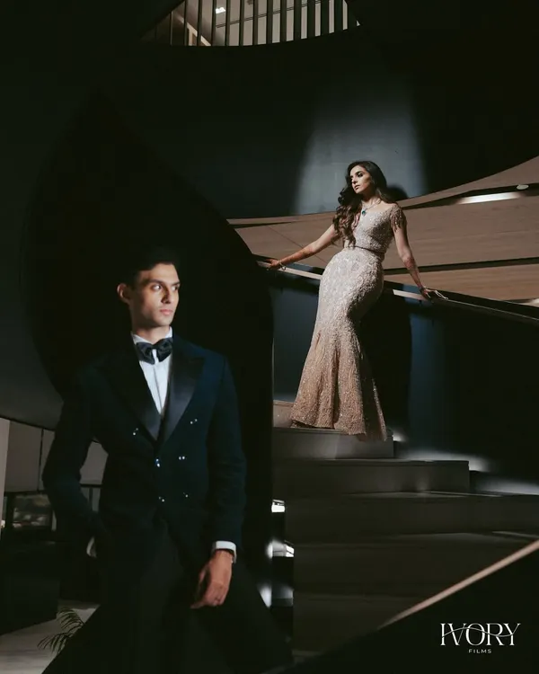 A masterpiece of light and shadow. We used this modern spiral staircase to create a dramatic, high-fashion portrait that feels both architectural and deeply romantic.