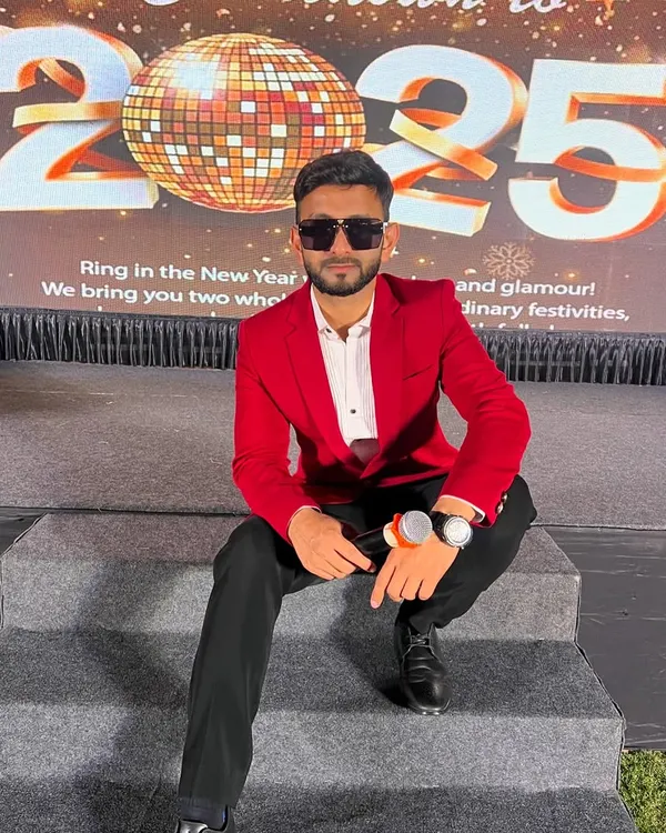 Taking a seat on the stage for the New Year's 2025 celebration. As a stage show host, I'm comfortable in any event setting, ready to bring the glamour and excitement.