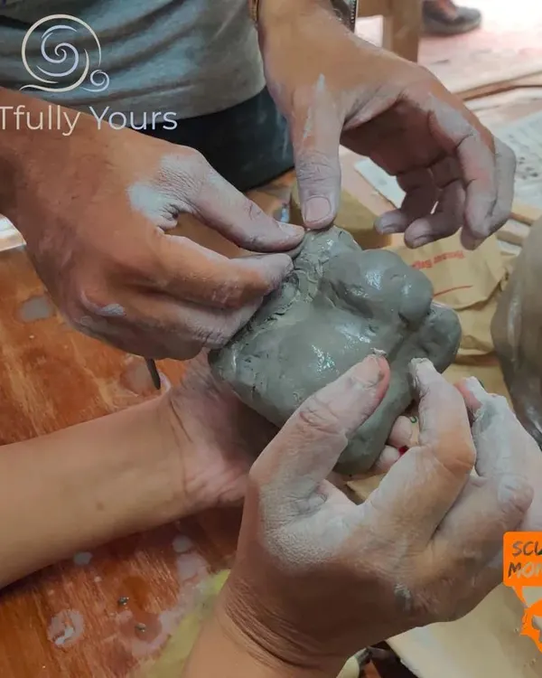 This is my favorite part of teaching. Guiding hands as they learn the feel of clay is a conversation without words. It’s a moment of shared focus and discovery, perfect for anyone starting their pottery journey.