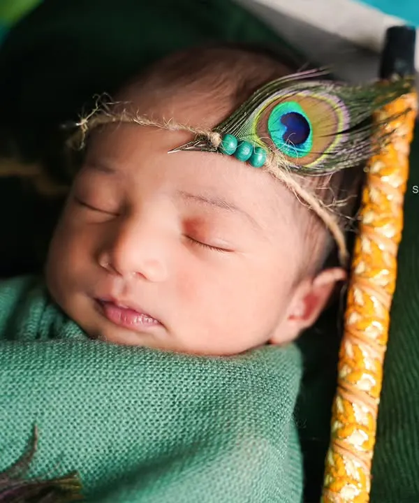 A close-up of a sweet, sleeping 6-day-old newborn. We focus on capturing these peaceful moments and delicate features during our at-home newborn sessions.