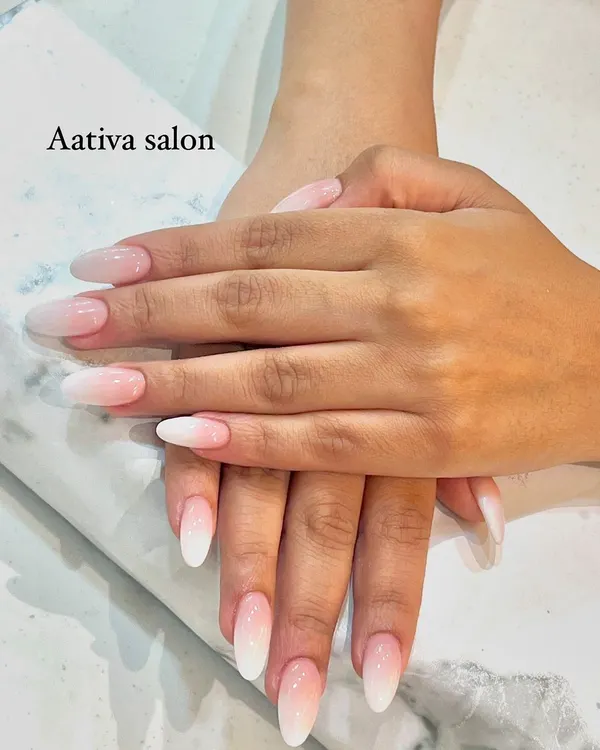 The perfect baby boomer or French ombré nails. We create a seamless gradient from a natural pink base to a soft white tip for a timeless and elegant look.