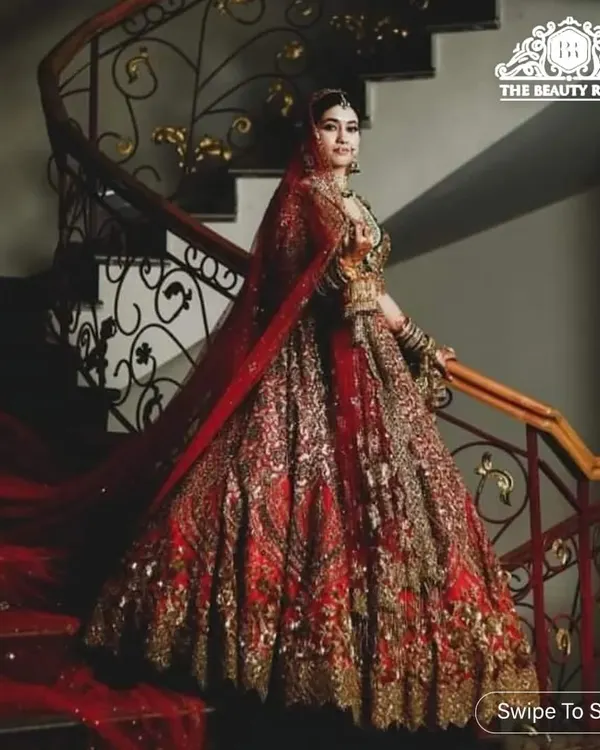 This is the ultimate dream bridal look. I created a classic, regal style with a heavily embroidered red lehenga, complete with flawless airbrush makeup and traditional jewellery. The entire look was designed to be breathtaking from every angle, ensuring the bride felt like royalty on her big day.