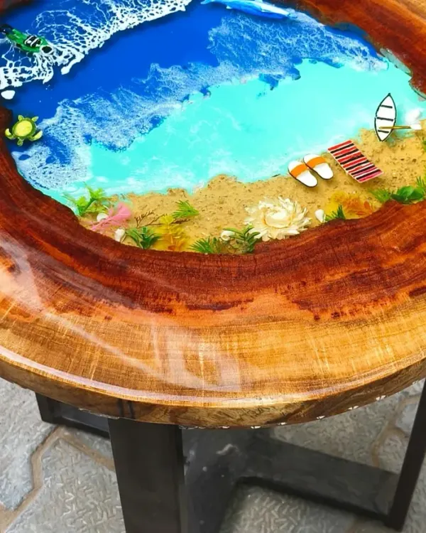 This is where my passion for resin art truly comes to life. I created this custom ocean-themed table by combining a live-edge wood slab with layers of pigmented epoxy resin. The details, from the sandy beach with miniature flip-flops to the gentle sea turtles, make it a one-of-a-kind piece of functional art.