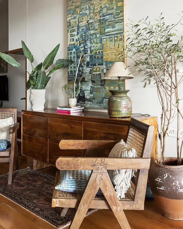 This living space from our 'Reweave Stories' project features a collection of modernist chairs and repurposed heirloom furniture. We believe in giving old pieces new life, weaving the client's personal history into the fabric of their home.