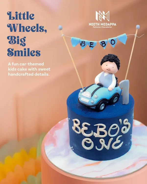 Little wheels, big smiles. This fun car-themed cake is perfect for a first birthday, featuring a cute fondant boy in his convertible.