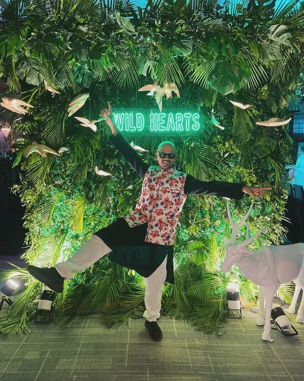 When life gives you a neon jungle, you strike a pose. Capturing the 'Wild Hearts' theme at a recent event. It's all about matching the vibe of the party.