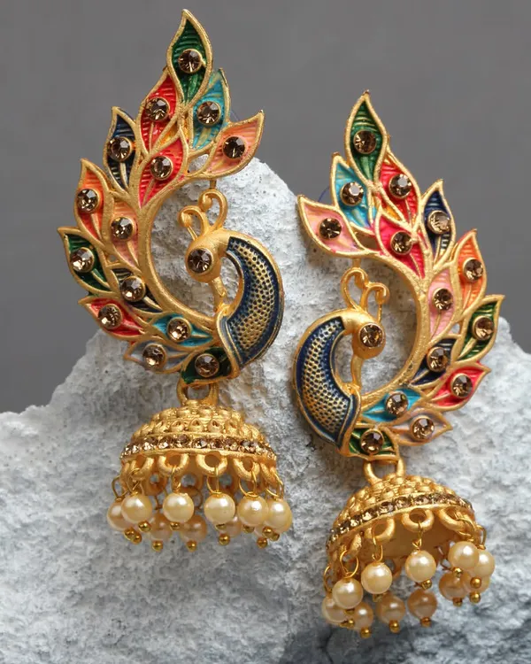 This is my poetry in jewels. A hand-painted meenakari peacock jhumka, where every color is a word and every detail is a verse. This is the kind of piece that feels like a celebration, crafted to be vibrant and surprisingly lightweight.