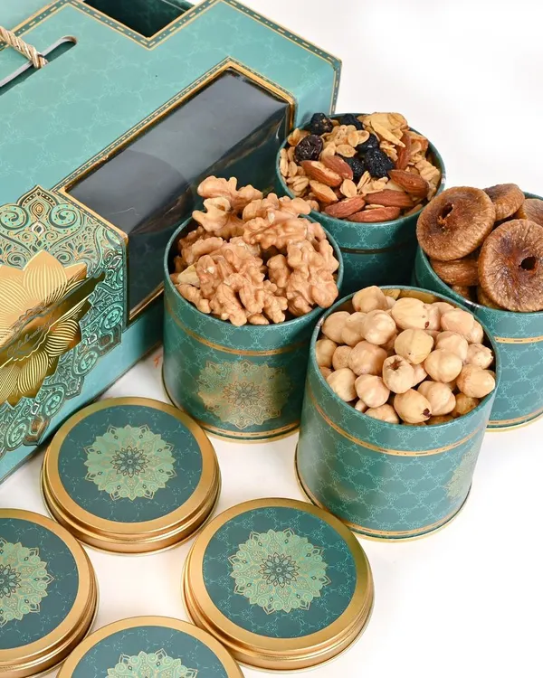 This is the kind of clean, crisp imagery I create for e-commerce brands that want to convey a sense of luxury. For this dry fruit hamper, I focused on a bright, white background to make the elegant teal and gold packaging pop, while ensuring the textures of the walnuts, figs, and hazelnuts are clearly visible.
