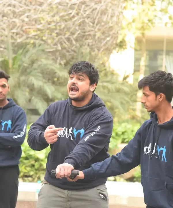 Here I am demonstrating a pistol disarm technique. The first step is always to redirect the weapon away from your body. Then, you use leverage and a swift counter-strike to take control of the firearm.