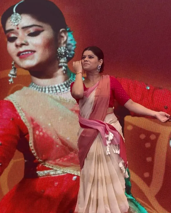 As an artist, I believe in sharing my art to inspire. Here, I am captured in a moment of 'abhinaya' during an interactive session at a college competition, connecting with the students through the language of Kathak.