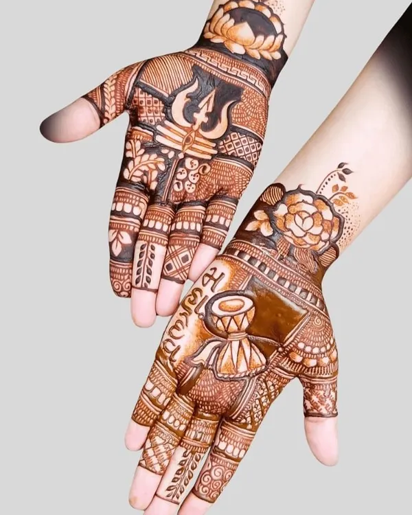 A powerful Sawan special design featuring Lord Shiva's Trishul and Damru. This kind of devotional art is very popular during the holy month.