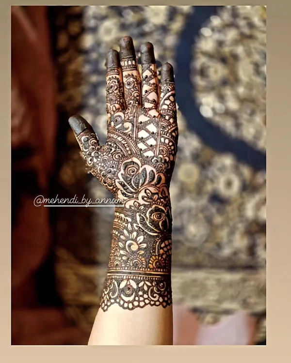 This is the kind of full-coverage Indian mehendi I love to create. Notice the fine lines, the mix of floral and geometric patterns, and the detailed work on each finger. It's a design that tells a story, perfect for a bride on her special day.