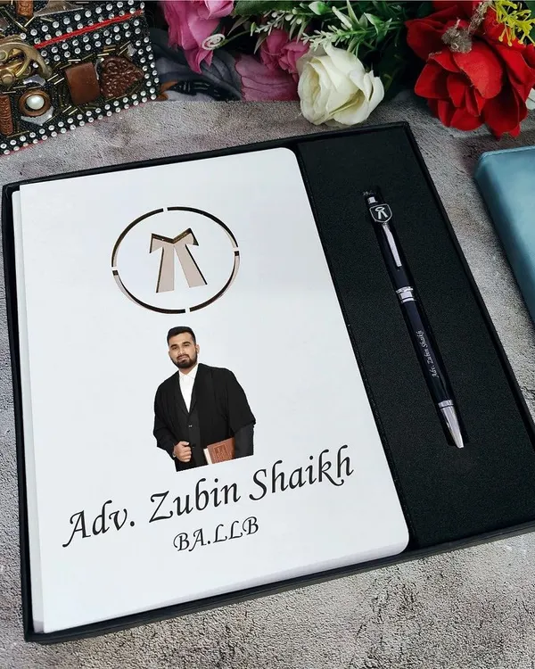 A premium gift for an advocate. This set includes a high-quality A5 diary with a photo, name, and advocate logo, paired with a matching personalized pen, all in a premium box.