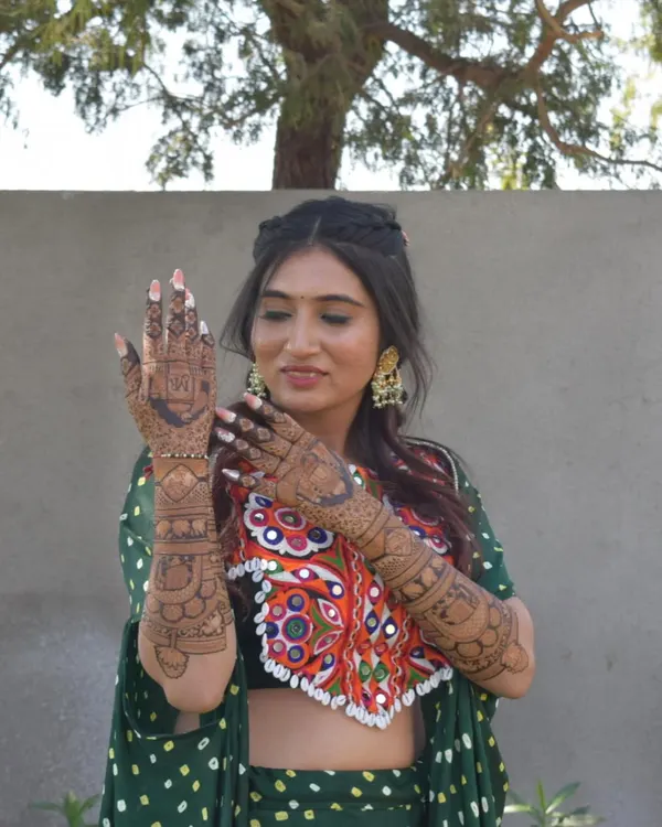 As a mehndi artist, I had always dreamed of my own bridal henna. Here I am on my mehndi day, so happy with how my vision came to life.