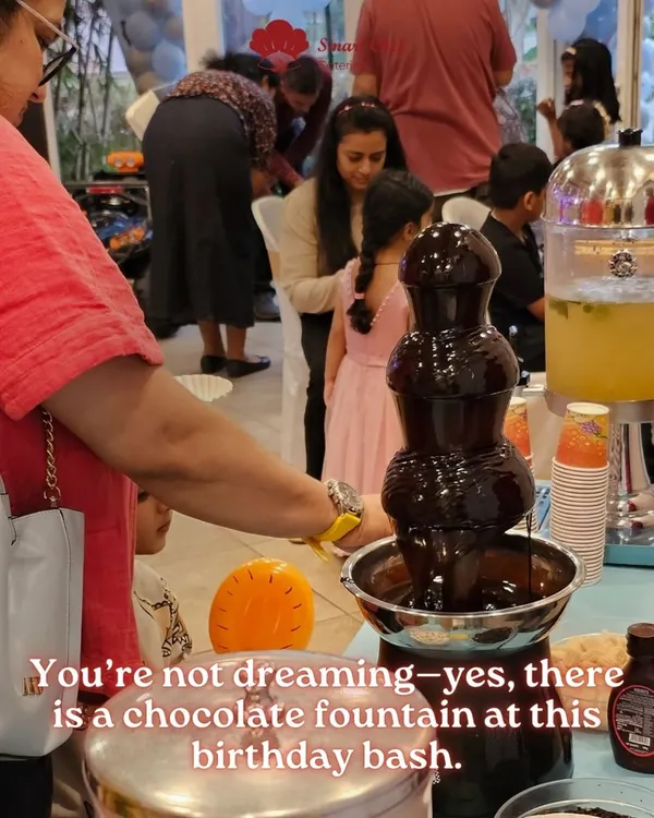 A chocolate fountain is always a showstopper, especially at a birthday bash. Guests of all ages love dipping marshmallows, fruits, and wafers into the flowing chocolate.