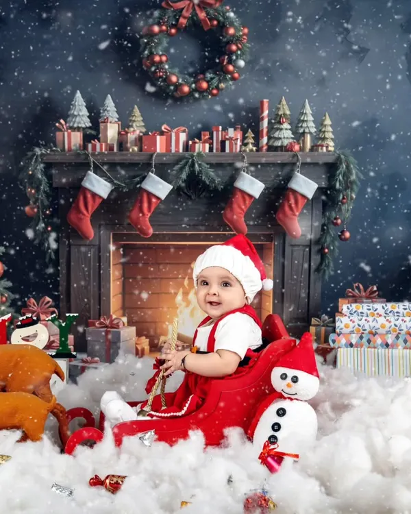 The most wonderful time of the year! This cozy Christmas fireplace scene is the perfect backdrop for your baby's first holiday portrait.