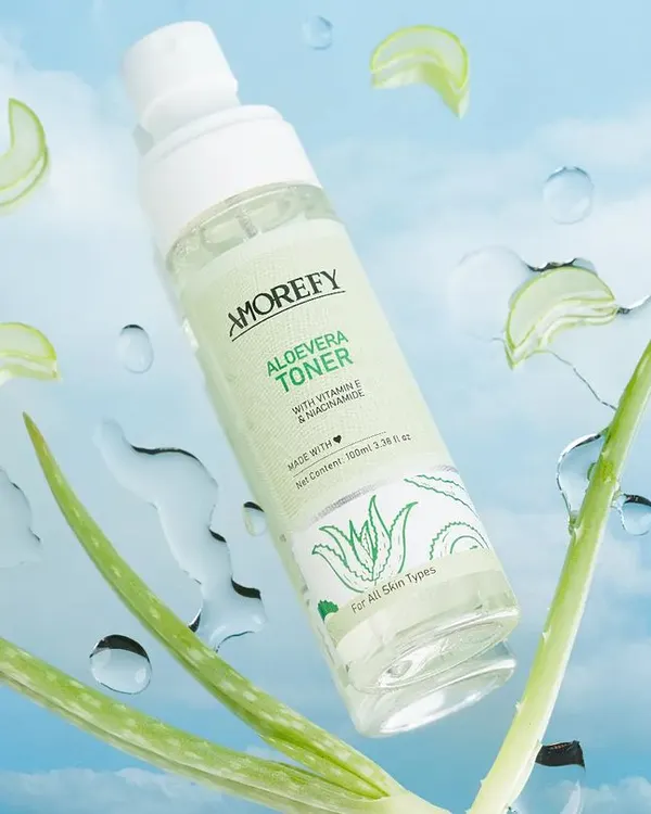 A refreshing shot of an aloe vera toner appearing to float against a sky backdrop with water splashes. We use creative editing and composition to create magical, eye-catching skincare visuals.