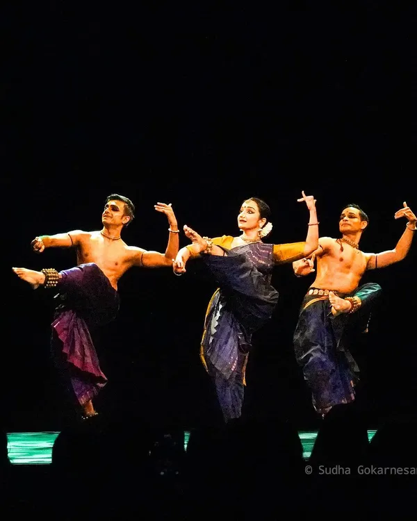 A powerful pose from 'ĀBHA', where the three of us come together to tell the story. The symmetry in our movements is key to conveying the unity and emotion of the narrative.