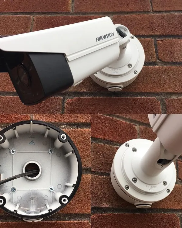 A closer look at a professional Hikvision camera installation on a brick wall. We use a junction box to protect all wiring from weather and tampering, ensuring a clean look and long-term durability for your security system.