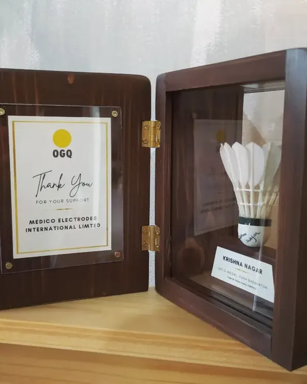 We were so honored to design this special series of shadow boxes for the Olympic Gold Quest (OGQ) to celebrate para-badminton player Krishna Nagar. The box preserves an autographed shuttlecock.