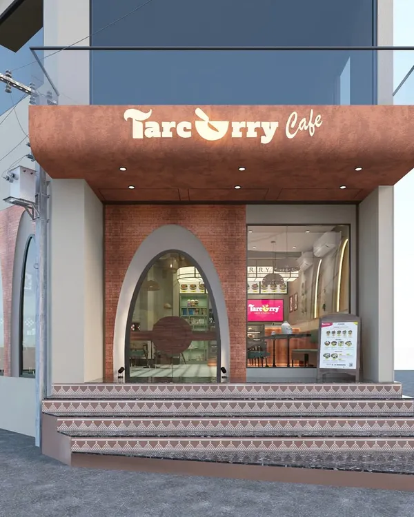 This is the exterior facade we designed for Tarcurry Cafe. The arched entrance and warm, textured materials create an inviting and memorable storefront that draws customers in from the street.