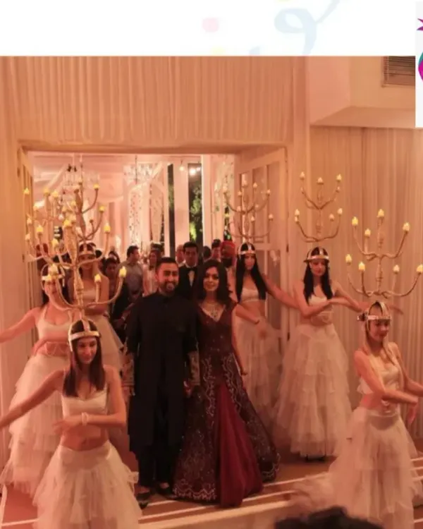 To elevate a corporate gala, we can arrange for unique live entertainment like these candle dancers. This welcome performance provides a sophisticated and visually stunning experience for guests as they enter the event.