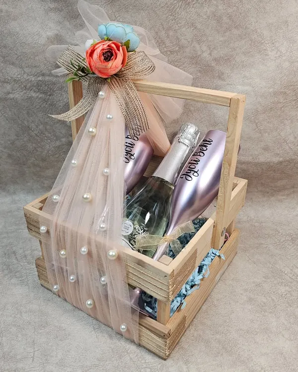 This elegant anniversary hamper, featuring personalized champagne glasses, is one of our favorite ways to help you celebrate love and milestones.