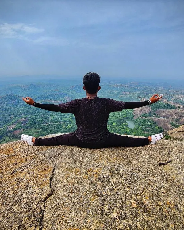 This is Samakonasana, or the side splits, performed at the top of Savanadurga hill. For me, yoga is not just a practice but a way to connect with the world around us. Achieving a pose like this, surrounded by nature, is a reminder of the strength and peace we can find when we align our body and mind.