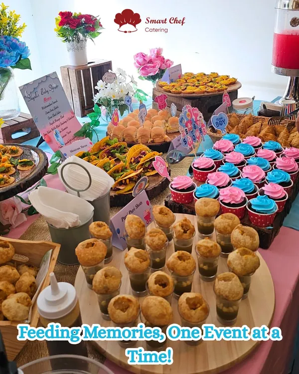 A beautiful baby shower grazing table, bursting with color and flavor. This spread features our popular pani puri shots, custom cupcakes, mini sliders, and fresh fruit, all designed to make your celebration a visual and culinary masterpiece.