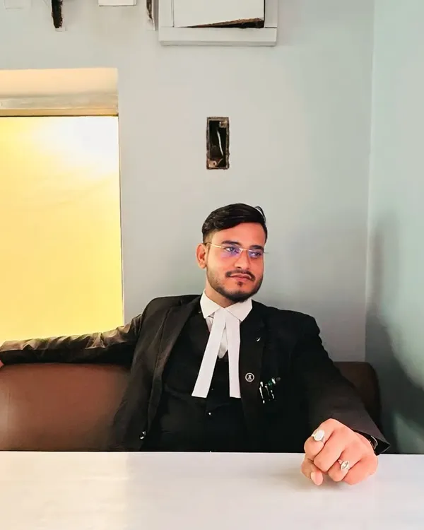 Seated in my office, ready for a client meeting. My focus is always on the goal, and I believe success is the direct result of hard work and passion.