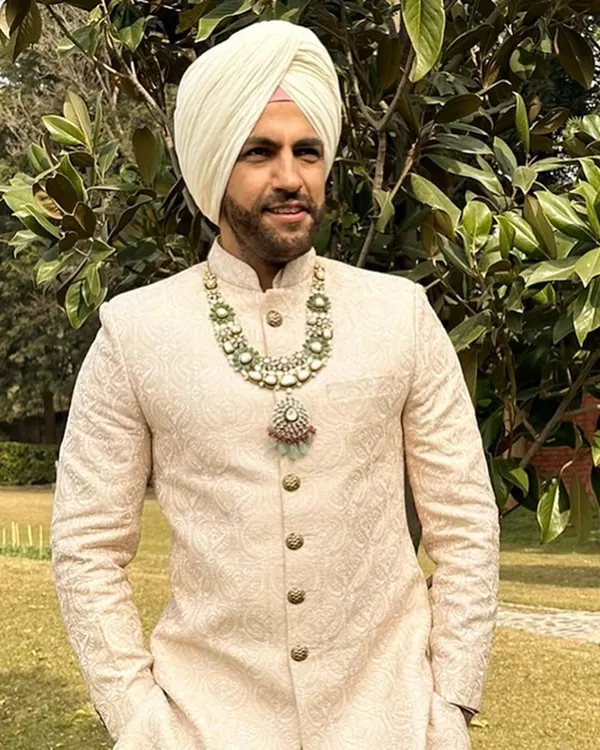 A close-up of a Sikh groom's look. I paired this elegant ivory sherwani with a magnificent multi-layered emerald and polki necklace, creating a look of pure regality.