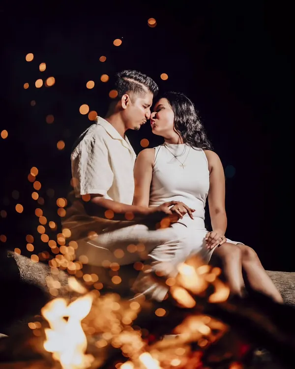 A romantic evening session for Eden and Snyder, using the warm glow of a bonfire to create an intimate and magical atmosphere. This is an example of a creative night shoot.