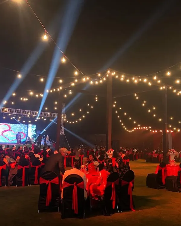 A full view of an outdoor gala dinner setup in Lonavala, showcasing our ability to handle large-scale events. The combination of stage lighting, an LED screen for branding, and organized seating ensures a professional and engaging experience for all attendees.