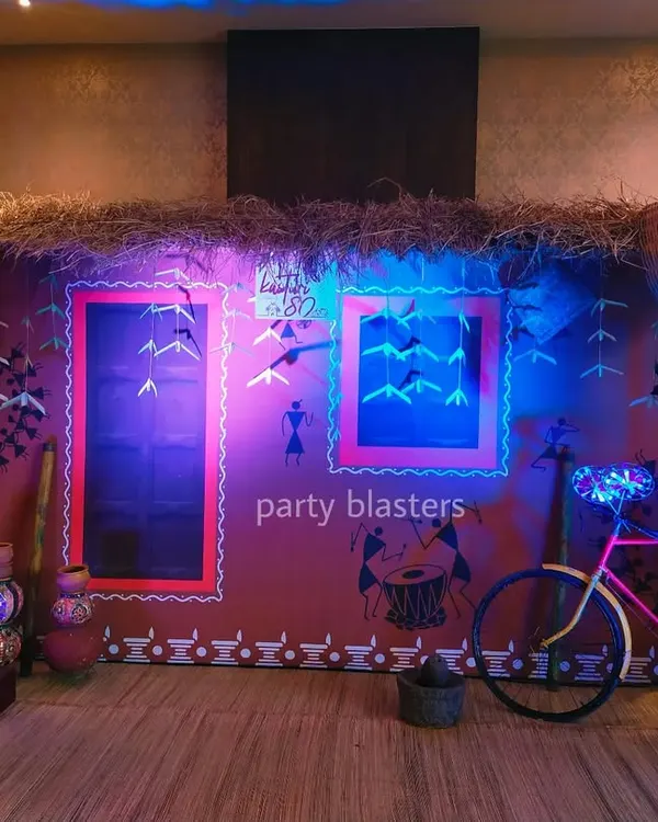 This immersive photo booth was the centerpiece of a corporate party with an Indian village theme. We used authentic materials like hay and woven baskets, combined with creative lighting and rustic props like a decorated bicycle, to create a memorable and interactive experience.