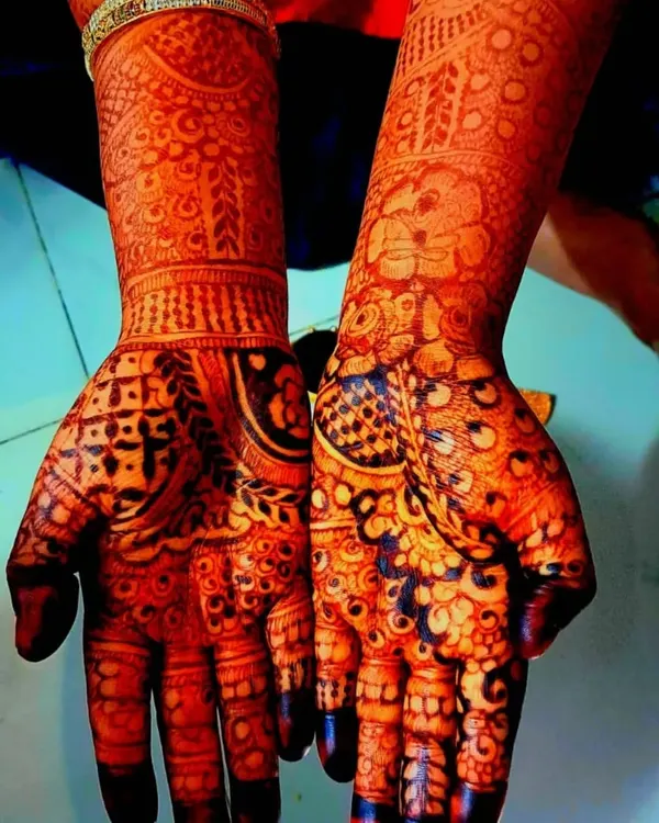 This is the result of using pure, natural henna. The stain is a deep, rich reddish-brown, showing the intricate details of the elephant and floral design beautifully.
