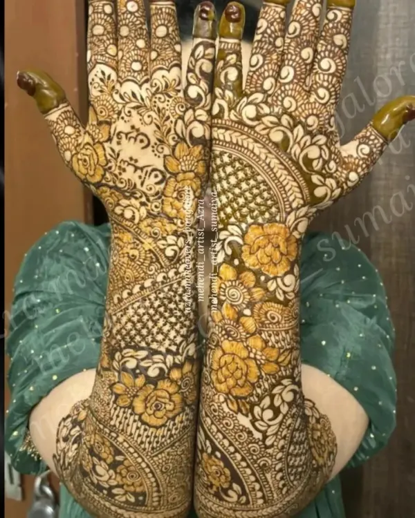 A stunning example of full coverage bridal mehendi, with a mix of floral, paisley, and geometric patterns for a rich and traditional look.