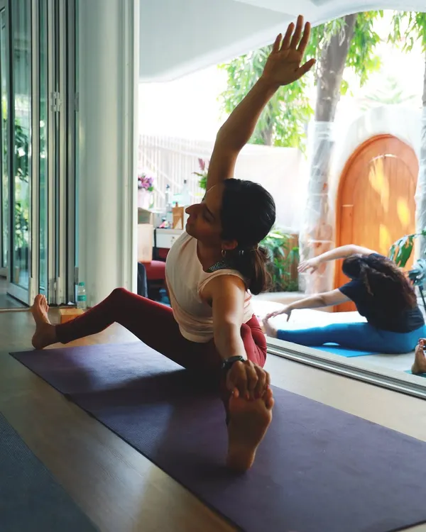 Finding the balance between effort and ease in Parivrtta Janu Sirsasana (Revolved Head-to-Knee Pose). This pose stretches the side body, hamstrings, and spine.