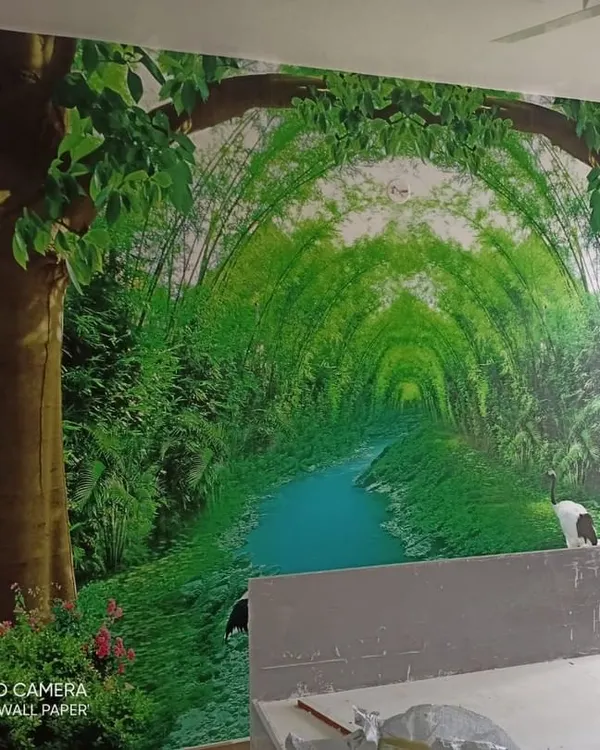 A stunning custom mural depicting a lush green bamboo tunnel over a stream, creating a sense of depth and tranquility in this bedroom.