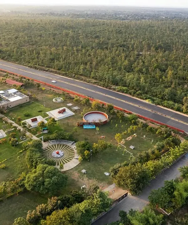 An aerial view of the H.N. Science Center in Gauribidanur, a project I designed for the community. The campus was built using earth excavated from on-site ponds to create the rammed earth walls, fully integrating the architecture with its landscape.