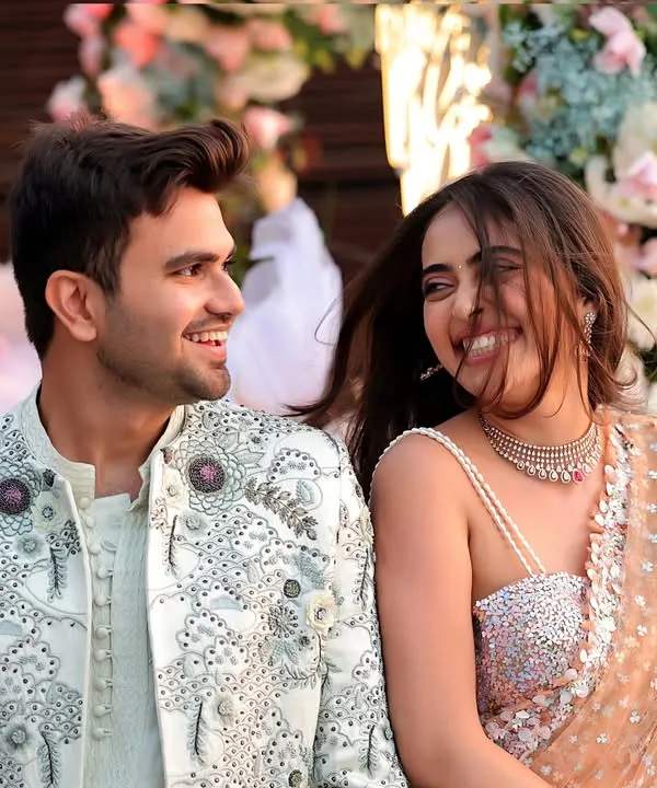 This is the kind of moment we live for. A genuine, unposed laugh between a couple, captured against a beautiful floral backdrop. It’s the pure joy of your wedding day that we aim to preserve.
