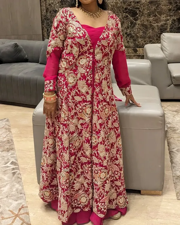 This two-in-one jacket gown is perfect for a destination wedding. Wear the heavy embroidered jacket for the ceremony and remove it for a simpler gown look at the reception.
